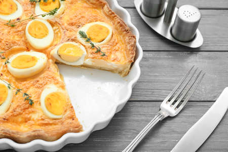 Tasty Easter tart with eggs on dark wooden background, closeupの写真素材