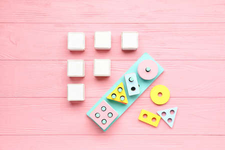 Cubes with blocks on pink wooden backgroundの写真素材