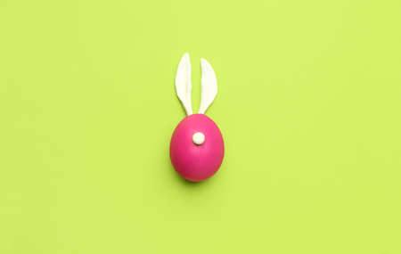 Rabbit made of painted Easter egg and bunny ears on green backgroundの写真素材