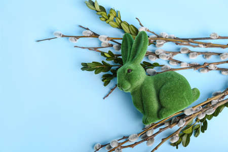 Willow branches and Easter bunny on blue backgroundの写真素材
