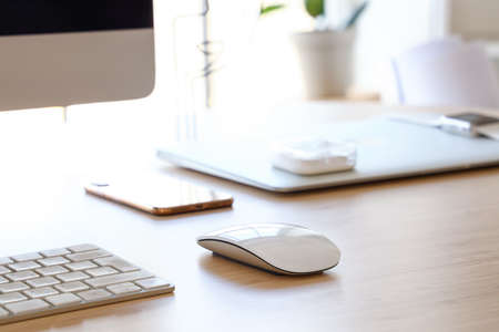 Modern computer mouse on tableの写真素材