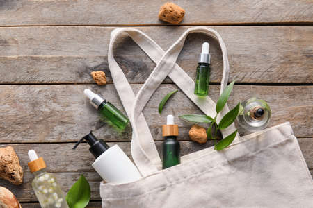 Shopping bag with natural cosmetics on wooden backgroundの写真素材