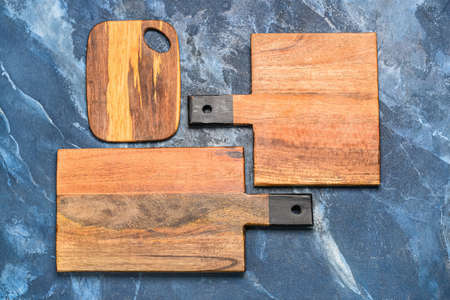 Wooden cutting boards on blue backgroundの写真素材