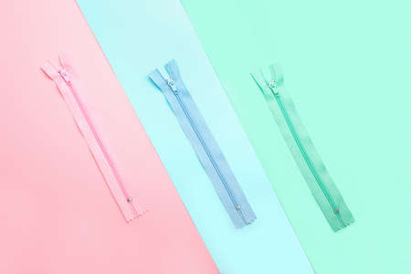 Stylish different zipper on color backgroundの写真素材