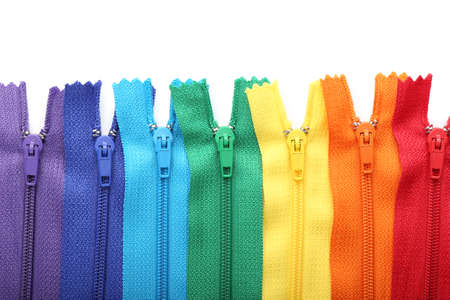 Stylish different zipper on white background
