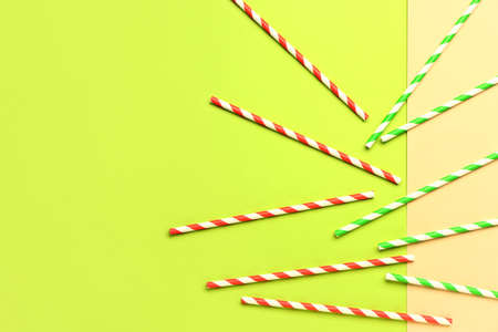 Stylish straws for drinks on green backgroundの写真素材