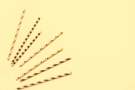 Stylish straws for drinks on yellow backgroundの写真素材