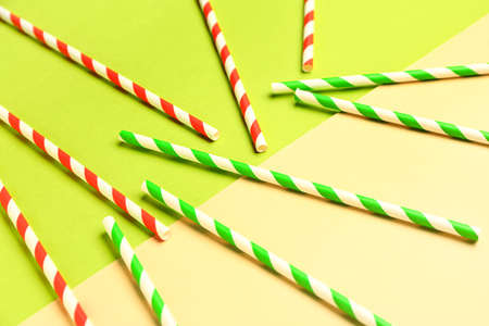 Stylish straws for drinks on green backgroundの写真素材