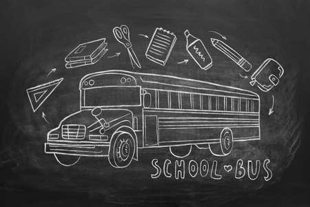 School bus and stationery drawn on blackboardの写真素材