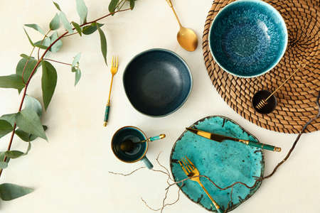 Trendy table setting with plant branch on light backgroundの写真素材