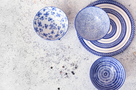 Different stylish plates on light backgroundの写真素材