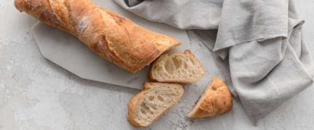 Fresh French baguette on grunge background