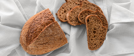 Fresh wholegrain bread on white napkin