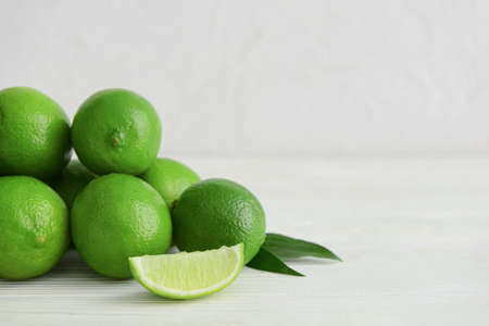 Pile of fresh limes on table, closeupの写真素材