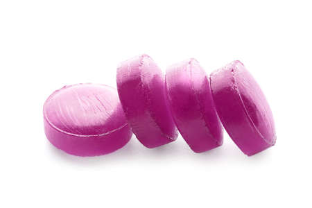 Purple pills for sore throat on white background