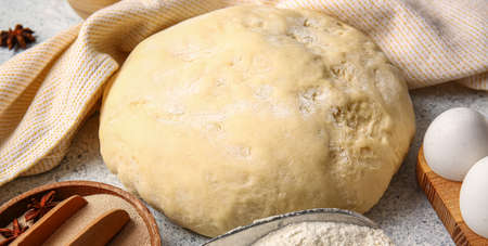 Fresh dough and ingredients on light table