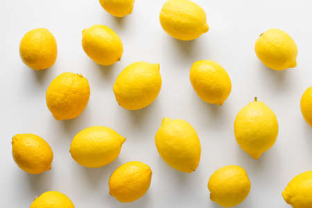 Many ripe lemons on white backgroundの写真素材