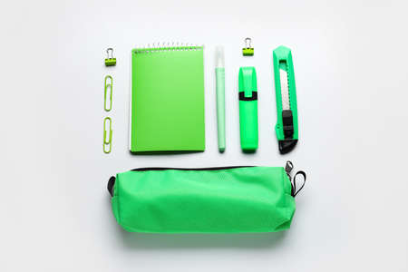 Pencil case with school stationery on white background, top viewの写真素材