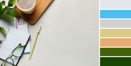 Notebooks with eyeglasses, pen and cup of coffee on light background. Different color patterns