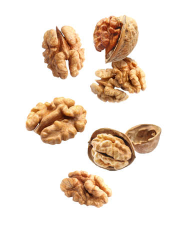Flying walnuts isolated on white