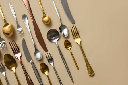Many different cutlery on color backgroundの写真素材