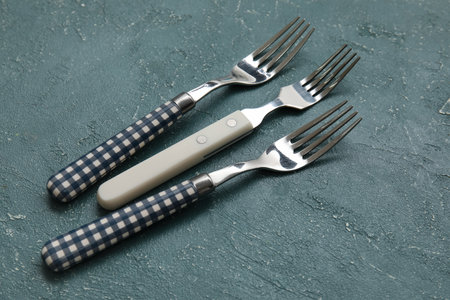 Different forks on gray background