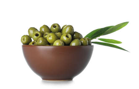 Bowl full of tasty green olives on white backgroundの写真素材