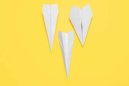 paper planes on yellow background
