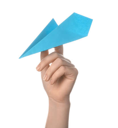 Woman with blue paper plane on white backgroundの写真素材