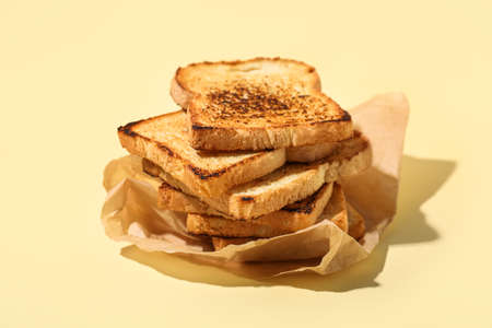 Stack of toasts on color backgroundの写真素材