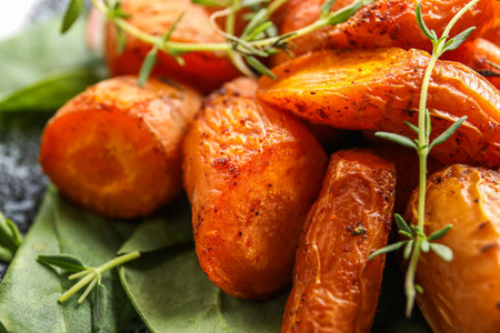 Tasty baked carrots with thyme, closeupの写真素材