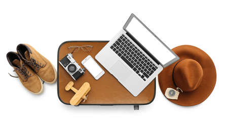 Male accessories for traveling with laptop and mobile phone on white backgroundの写真素材