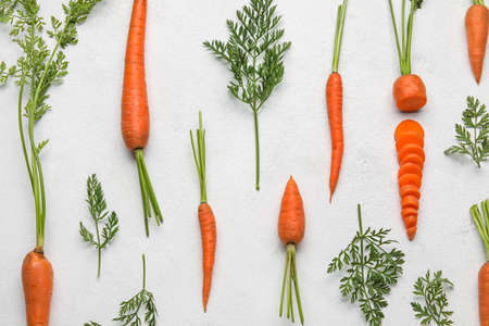 Composition with fresh carrots on light backgroundの写真素材