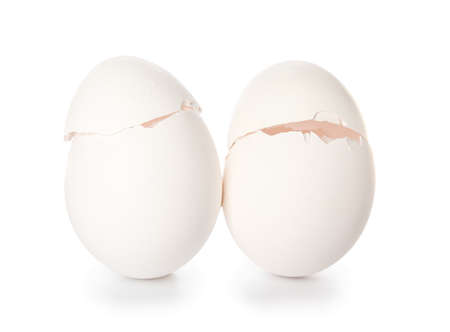 Cracked egg shells on white background