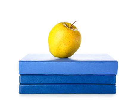 Books and apple on white backgroundの写真素材