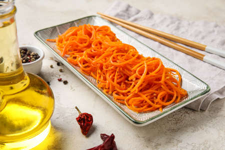 Bowl of aromatic korean carrot salad on table, closeupの写真素材