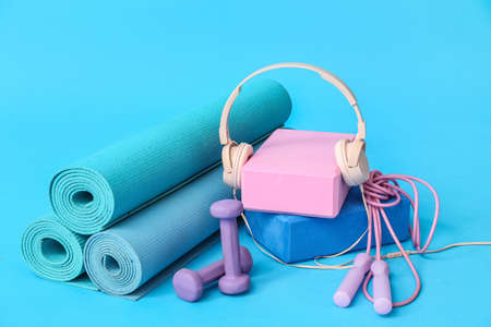 Composition with sports equipment and modern headphones on color backgroundの写真素材
