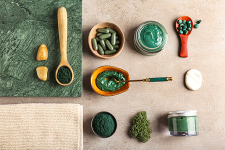 Composition with spirulina facial mask and ingredients on grunge backgroundの写真素材