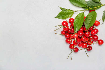Heap of sweet cherry on light background