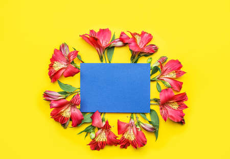 Composition with blank card and alstroemeria flowers on color backgroundの写真素材
