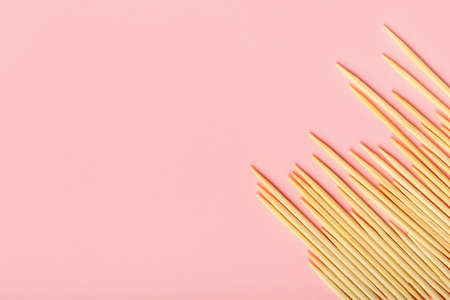 Wooden toothpicks on pink backgroundの写真素材
