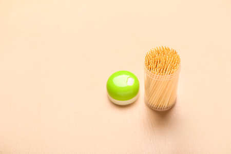 Holder with toothpicks on color backgroundの写真素材