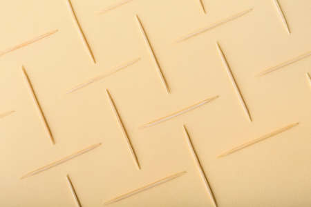 Composition with toothpicks on color background