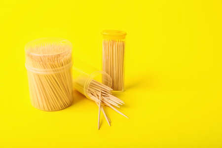 Holders with toothpicks on yellow backgroundの写真素材