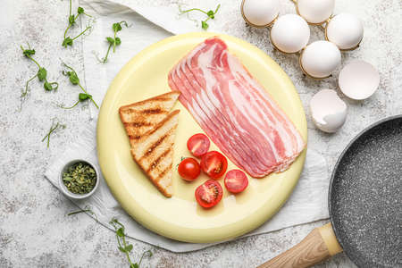 Composition with ingredients for preparing tasty fried eggs on light backgroundの写真素材