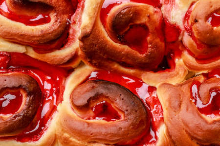 Strawberry cinnamon rolls as background, closeup