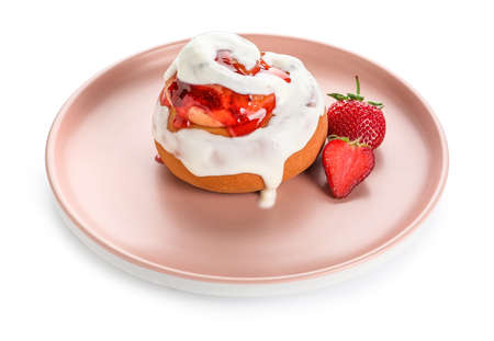 Plate of strawberry cinnamon roll with cream on white backgroundの写真素材