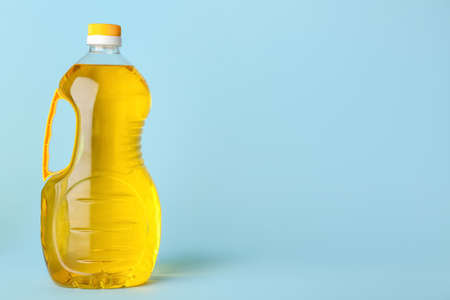 Bottle of sunflower oil on blue backgroundの写真素材
