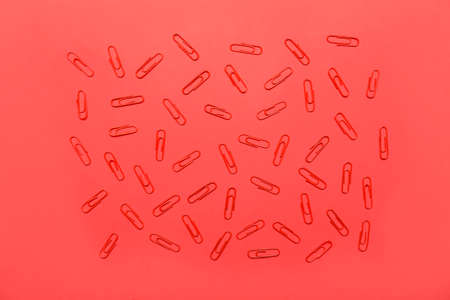 paper clips on red backgroundの写真素材