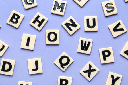 Different letters on violet background. Alphabet concept